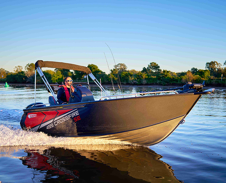 Revolutionary Hull with a grey and white aluminum fishing boat with a hardtop cabin